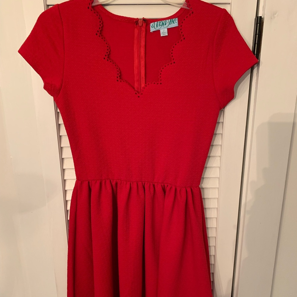 Francesca’s red dress with laser cut details